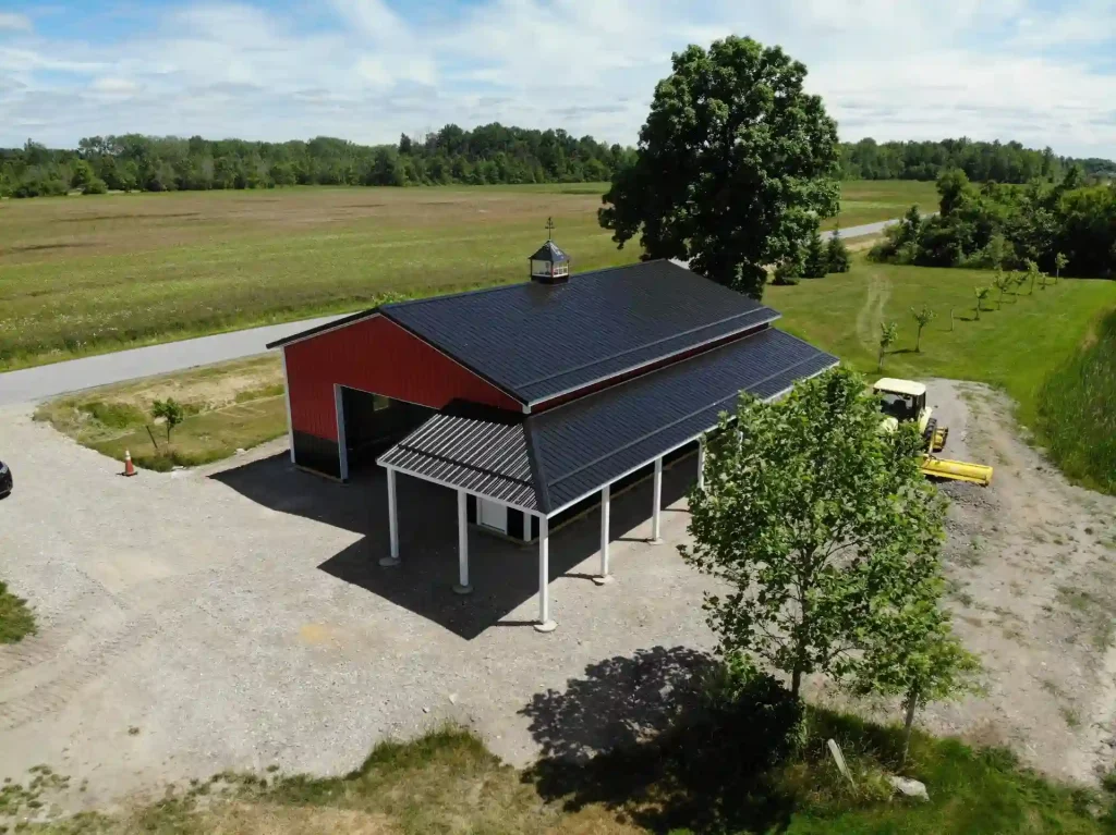 Red pole barn by Stately Post Frame in Clarence Center, NY.