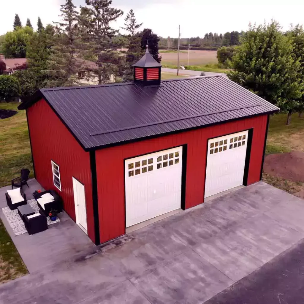 Red two car post frame pole barn garage in Clarence, NY. Constructed by Stately Post Frame.