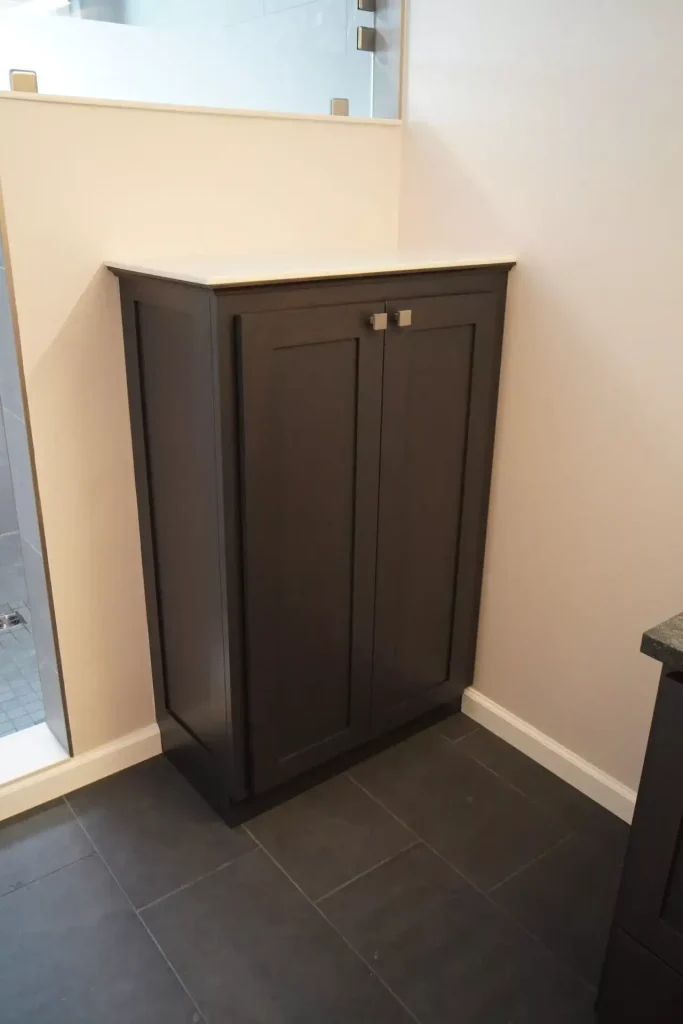 Custom linen cupboard. Master bathroom remodel in Clarence, NY by Stately Kitchen and Bath.