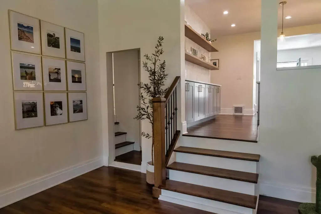 Custom woodwork. Stairs. Modern kitchen with natural elements by Stately Kitchen and Bath in Amherst, NY.