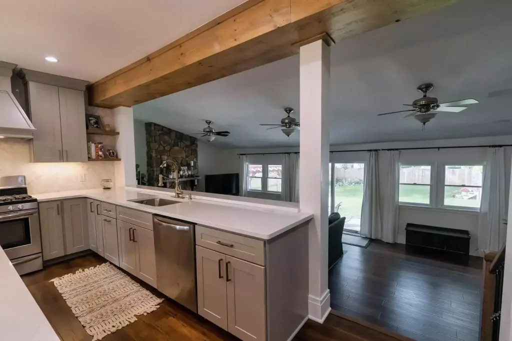 Countertop and window into living area. Modern kitchen with natural elements by Stately Kitchen and Bath in Amherst, NY.