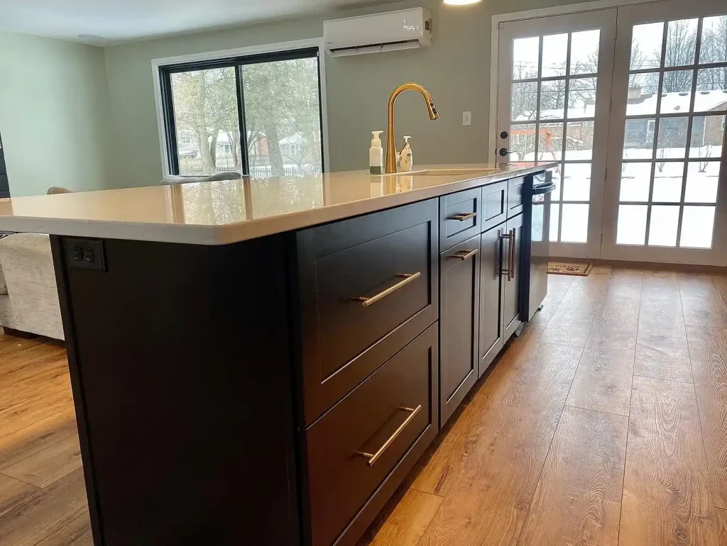 Kitchen island. Trendy black and white kitchen by Stately Kitchen and Bath in Clarence Center, NY.