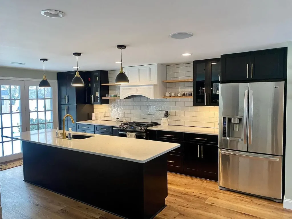 Kitchen overview. Trendy black and white kitchen by Stately Kitchen and Bath in Clarence Center, NY.