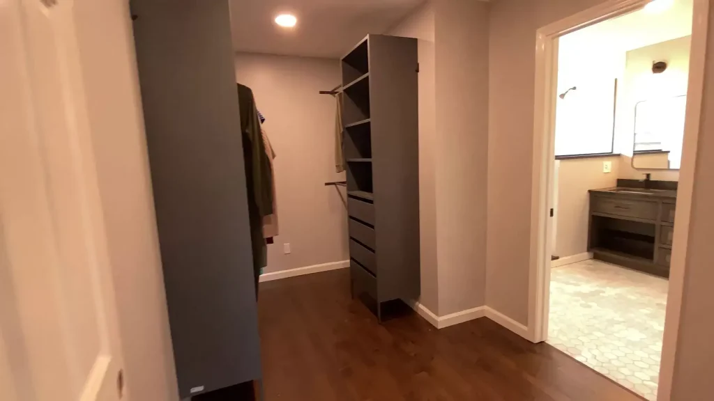 Luxurious walk-in closet by Stately Kitchen and Bath in Clarence, NY.