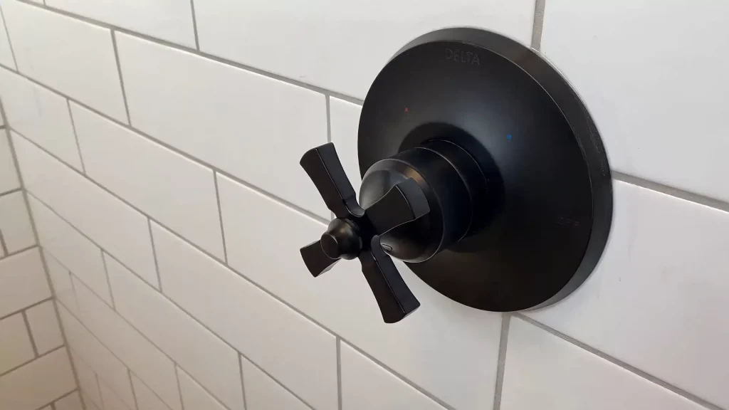 Sleek black fixtures as part of a luxury bathroom remodel in Clarence, NY.