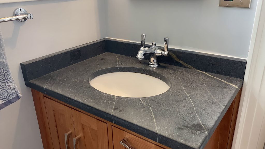 Custom vanity by Reusch Woodworking, installed by Stately Kitchen and Bath in Kenmore, NY.