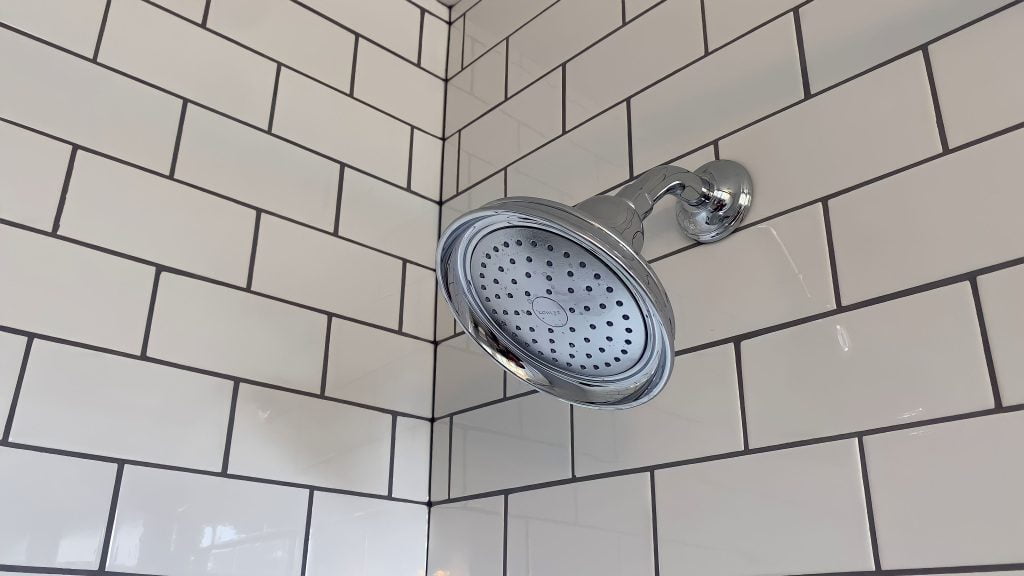 Chrome fixtures and expertly-installed subway tile by Stately Kitchen and Bath in Kenmore, NY.