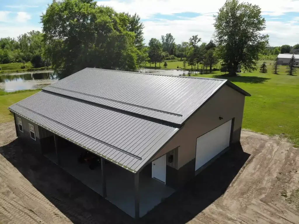 Post frame pole barn garage with lean to and large overhead doors – constructed by Stately Post Frame in Clarence Center, NY.