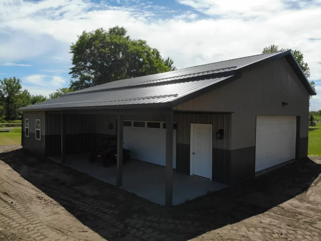 Post frame pole barn garage with lean to and large overhead doors – constructed by Stately Post Frame in Clarence Center, NY.