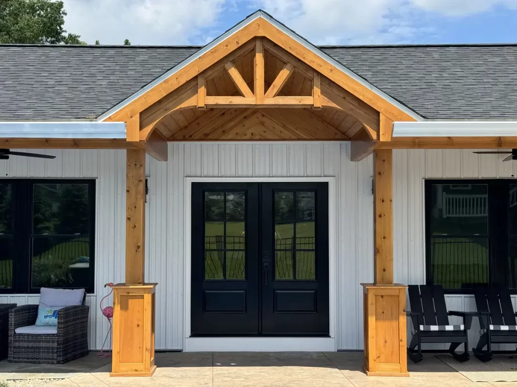 Detailed view of the double doors and custom millwork on the pool house addition in Akron, NY, crafted by Stately General Contracting.