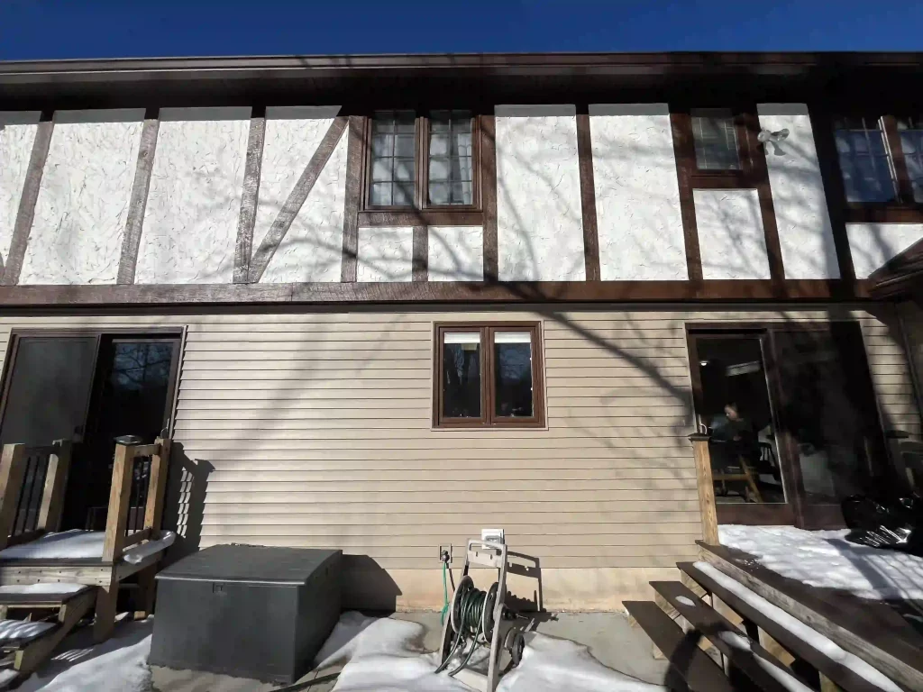 Exterior of the house showing the old window to be replaced.