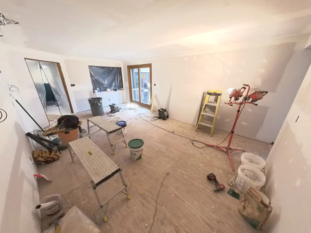 Kitchen remodel in progress with drywall installation and tools by Stately Kitchen and Bath.