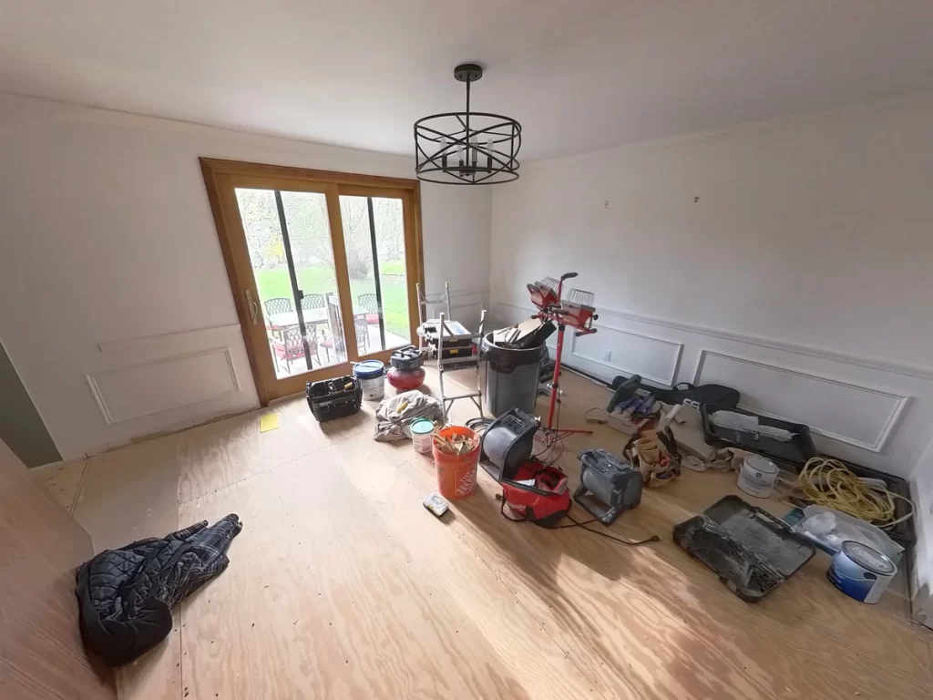 Construction tools and materials in dining area during kitchen remodel by Stately Kitchen and Bath.