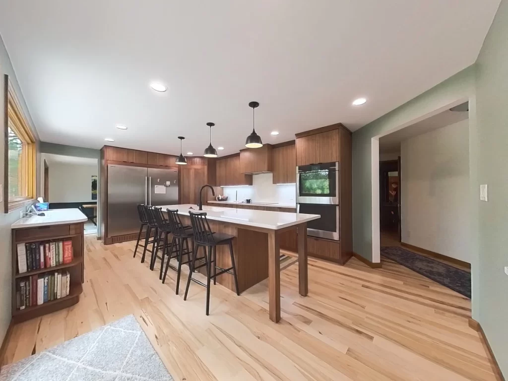 Completed kitchen remodel by Stately Kitchen and Bath showcasing stainless steel appliances and custom cabinetry.