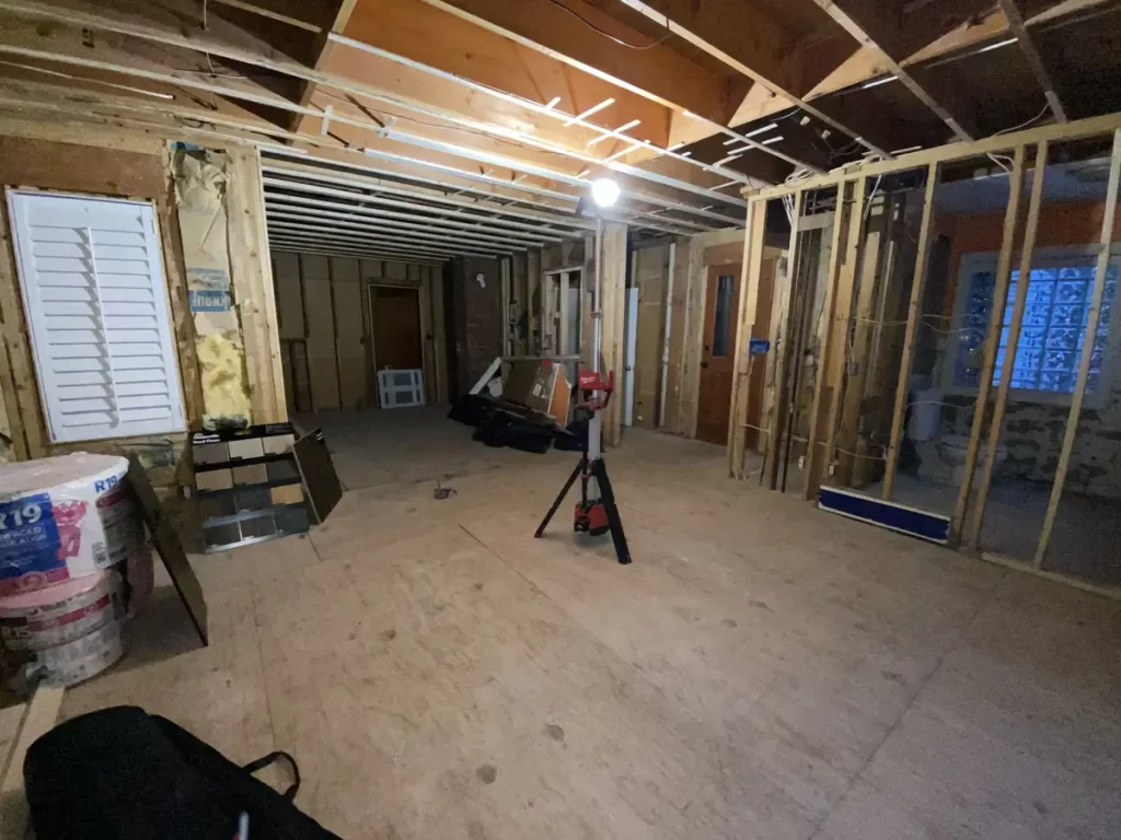 Remodeling process showing exposed walls and construction materials in Amherst, NY by Stately Kitchen and Bath.