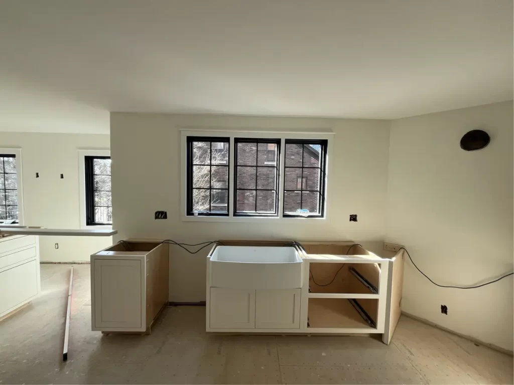 Kitchen remodel in Amherst, NY - construction stage with cabinets and countertops being installed.