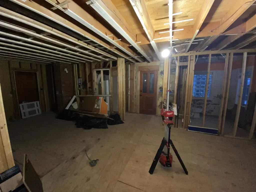 Kitchen remodel in Amherst, NY - construction stage with a wide view of the kitchen area being framed.