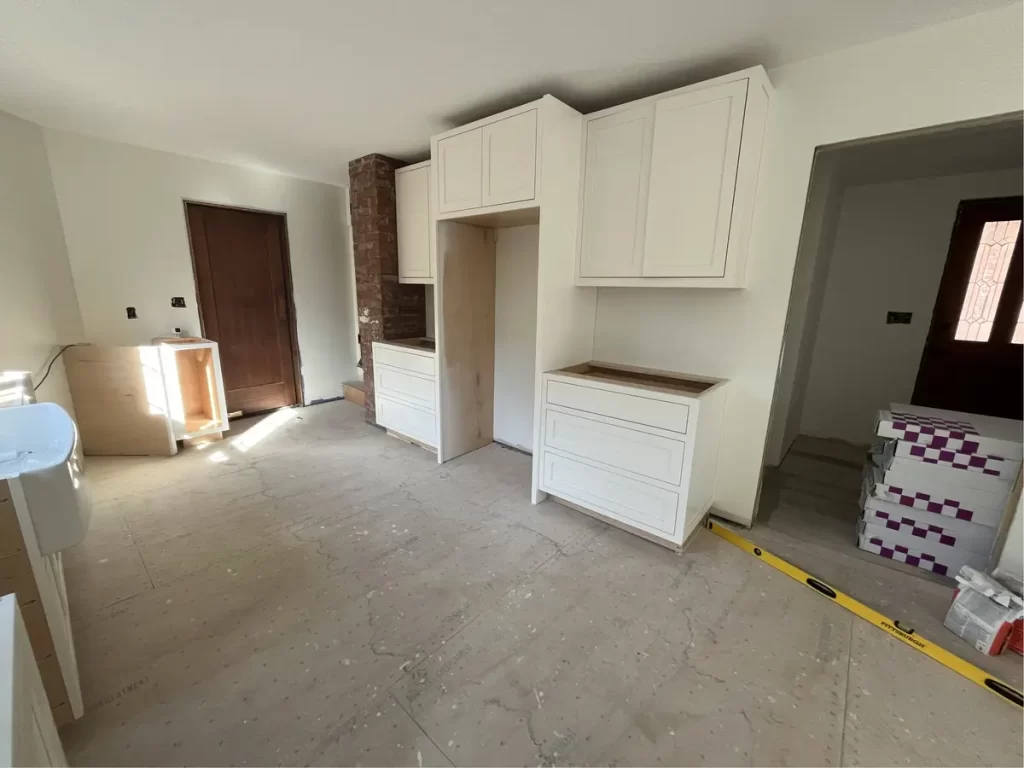 Kitchen remodel with new flooring and cabinetry being installed, Amherst NY.