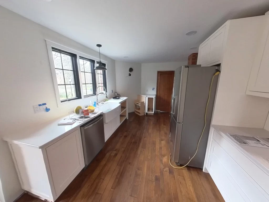 Kitchen remodel under construction with cabinetry and flooring in place, Amherst NY.