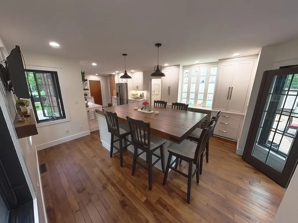 Remodeled kitchen featuring a large wooden island and built-in cabinets in Amherst, NY by Stately Kitchen and Bath.