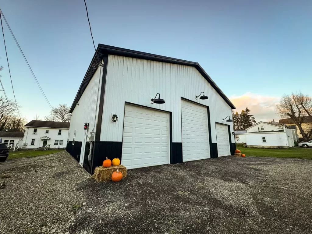 Close-up of Stately’s craftsmanship on a Pole Barn in Holland, NY, highlighting garage doors, black trim, and attention to design detail.