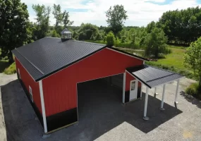 Red pole barn by Stately Post Frame in Clarence Center, NY.