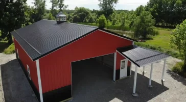 Red pole barn by Stately Post Frame in Clarence Center, NY.