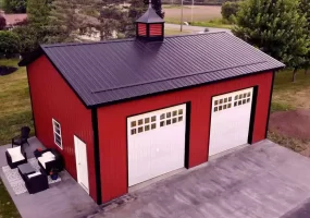 Red two car post frame pole barn garage in Clarence, NY. Constructed by Stately Post Frame.