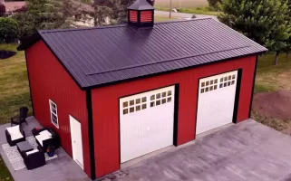 Red two car post frame pole barn garage in Clarence, NY. Constructed by Stately Post Frame.