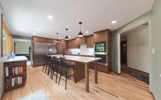 Completed kitchen remodel by Stately Kitchen and Bath showcasing stainless steel appliances and custom cabinetry.