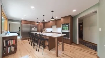 Completed kitchen remodel by Stately Kitchen and Bath showcasing stainless steel appliances and custom cabinetry.